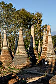 Inle Lake Myanmar. Indein, on the summit of a hill the  Shwe Inn Thein Paya a cluster of hundreds of ancient stupas. Many of them are ruined and overgrown with bushes.